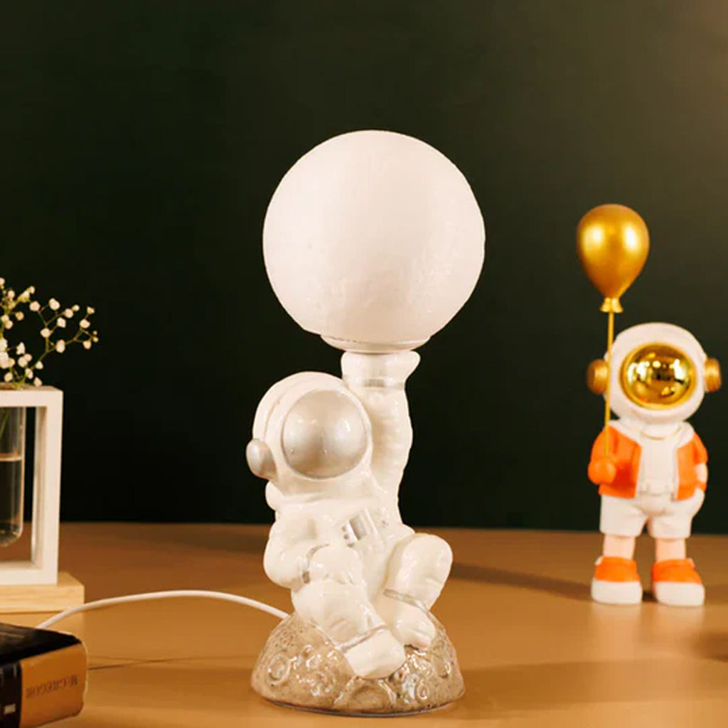 Astronaut resin table lamp with detailed space suit design, modern decor piece for a contemporary living space